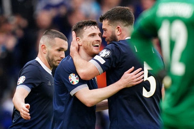 Scotland’s John McGinn, Andrew Robertson and Grant Hanley celebrate 