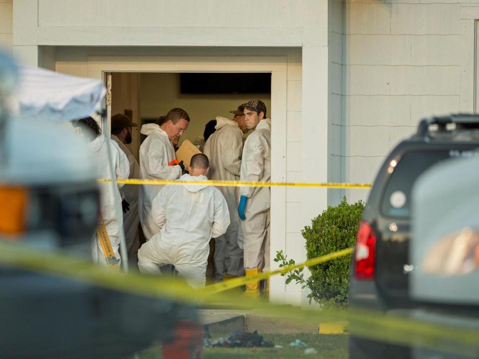 Law enforcement officials investigate the scene at the First Baptist Church in Sutherland Springs, Texas (Reuters)