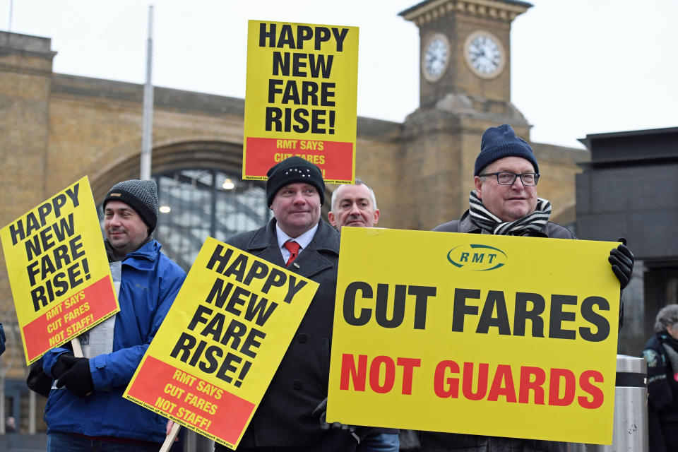 Campaigners staged protests at 40 railway stations up and down the country, including here outside King’s Cross station in London (Stefan Rousseau/PA Wire)