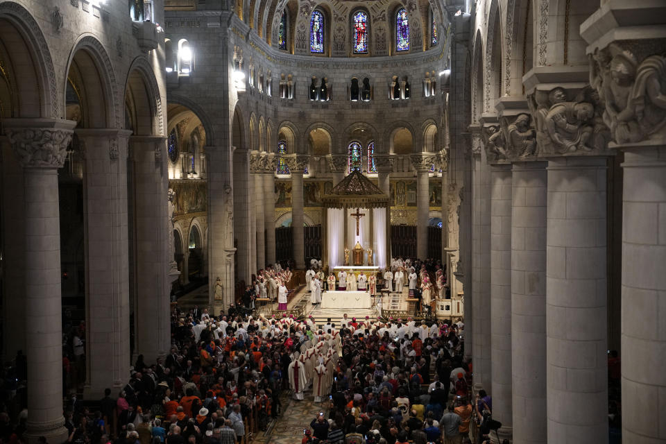 Pope Francis presides over a mass at the National Shrine of Saint Anne de Beaupre, Thursday, July 28, 2022, in Saint Anne de Beaupre, Quebec. Pope Francis is on a "penitential" six-day visit to Canada to beg forgiveness from survivors of the country's residential schools, where Catholic missionaries contributed to the "cultural genocide" of generations of Indigenous children by trying to stamp out their languages, cultures and traditions. (AP Photo/John Locher)