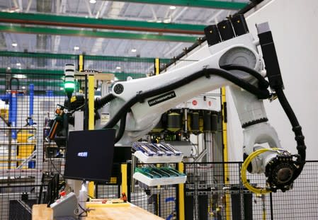 An Electroimpact automated fiber placement machine, which lays down carbon fiber strips onto the 777X spar, is seen during a media tour of the Boeing 777X at the Boeing Composite Wing Center in Everett