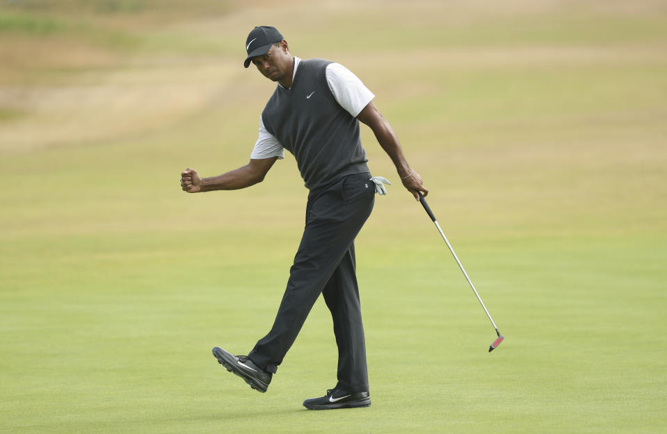 Tiger Woods capped a three-under front nine with a long birdie putt. (AP Photo/Peter Morrison)