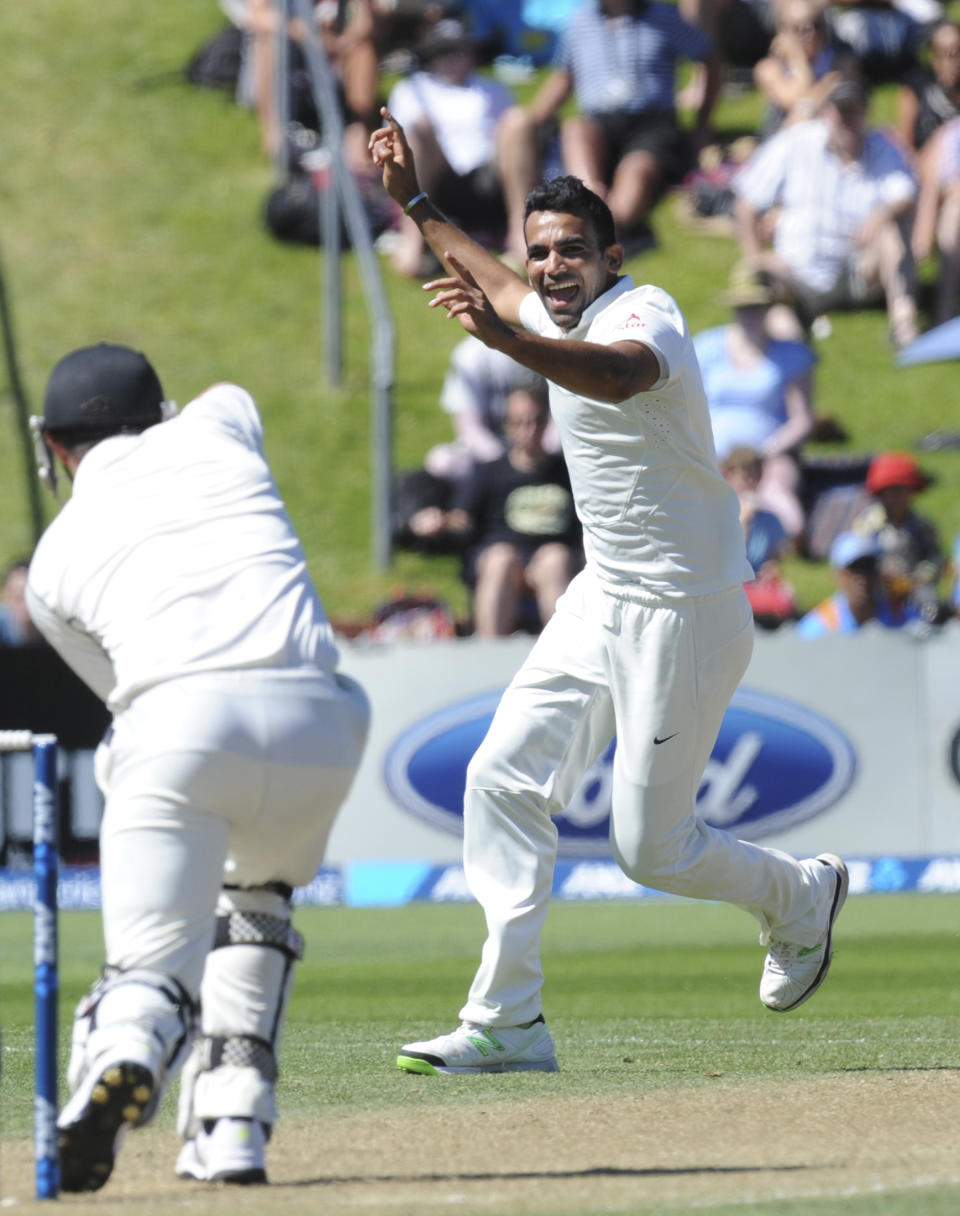 India’s Zaheer Khan, right, successfully appeals the wicket of New Zealand’s Hamish Rutherford fpr 35 on the third day of the second cricket test at Basin Reserve, in Wellington, New Zealand, Sunday, Feb. 16, 2014. (AP Photo/SNPA, Ross Setford) NEW ZEALAND OUT
