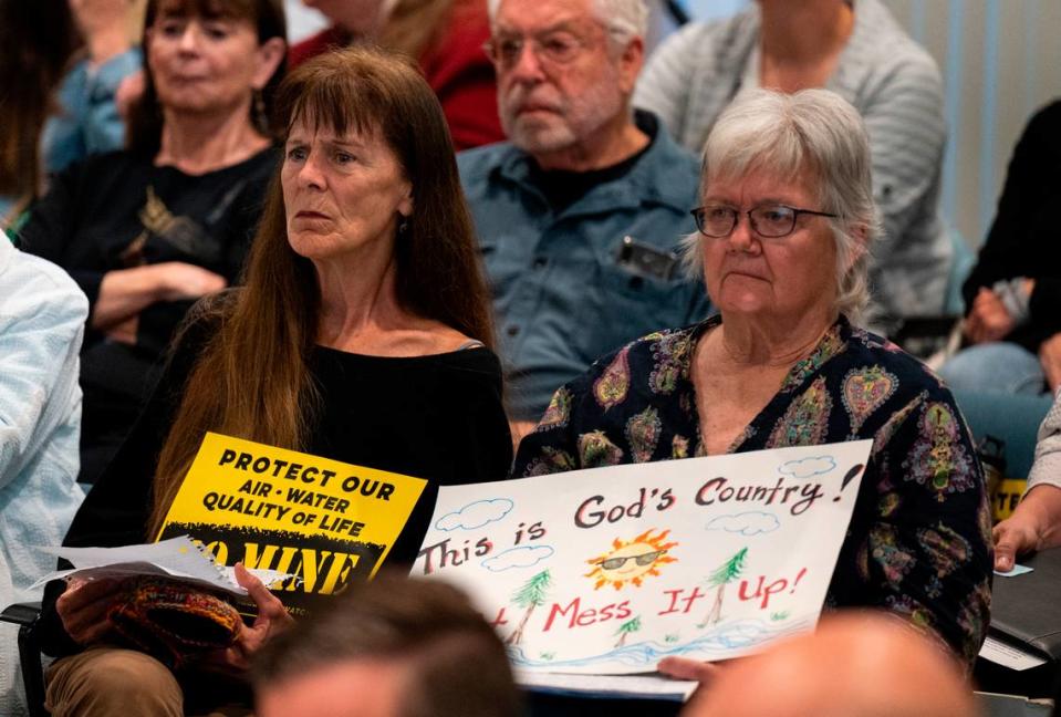 “This is God’s country! Don’t mess it up,” reads the handmade sign of JoAnne McIntire, right, in opposition to the Idaho-Maryland Mine during the second day of the planning commission’s hearing on the project in May. She sits with Nevada City resident Sharon Lipski, who also opposes the project.