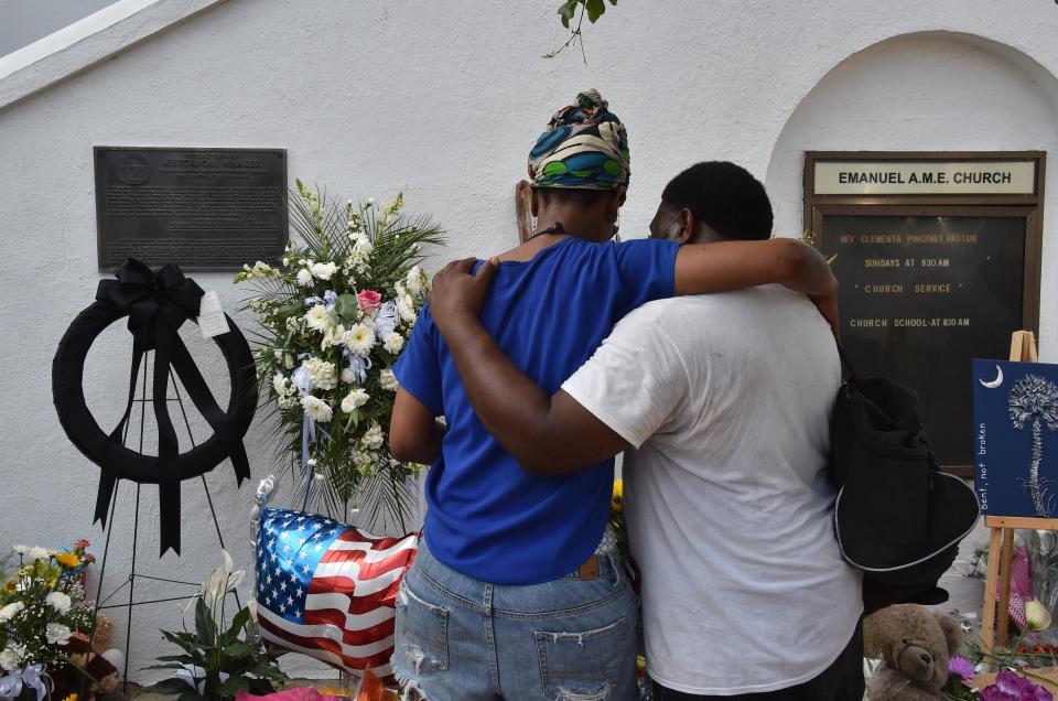 People pray outside Emanuel AME Church in Charleston, S.C., on June 19, 2015.