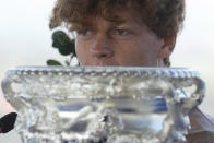Italian tennis player Jannik Sinner speaks in front of the Australian Open trophy he won on Sunday during a press conference in Rome, Wednesday, Jan. 31, 2024. Sinner, 22, was the the first Italian to win the Australian Open that is the first grand slam title of his career. (AP Photo/Gregorio Borgia)