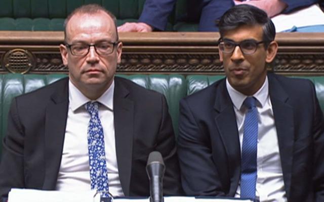 Chris Heaton-Harris, the Northern Ireland Secretary, and Rishi Sunak, the Prime Minister, are pictured in the House of Commons this afternoon - Getty Images