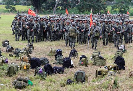 Members of the Philippine Marine Battalion Landing Team (MBLT) and Marine Special Operation Group (MARSOG) stand at attention in front of their belongings during their send-off ceremony. REUTERS/Romeo Ranoco