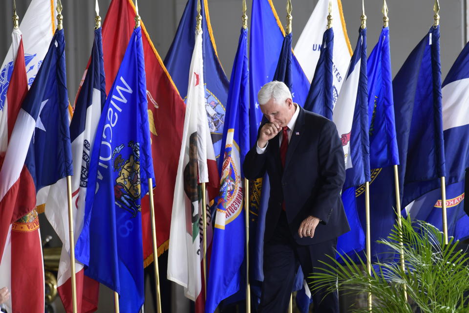 Vice President Mike Pence walks from the podium after speaking at a ceremony marking the arrival of the remains believed to be of American service members who fell in the Korean War at Joint Base Pearl Harbor-Hickam, Hawaii, Wednesday, Aug. 1, 2018. North Korea handed over the remains last week. (AP Photo/Susan Walsh)