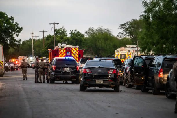 Police block off the road leading to the scene of a school shooting at Robb Elementary on Tuesday, May 24, 2022 in Uvalde, Texas. (Sergio Flores for The Texas Tribune)