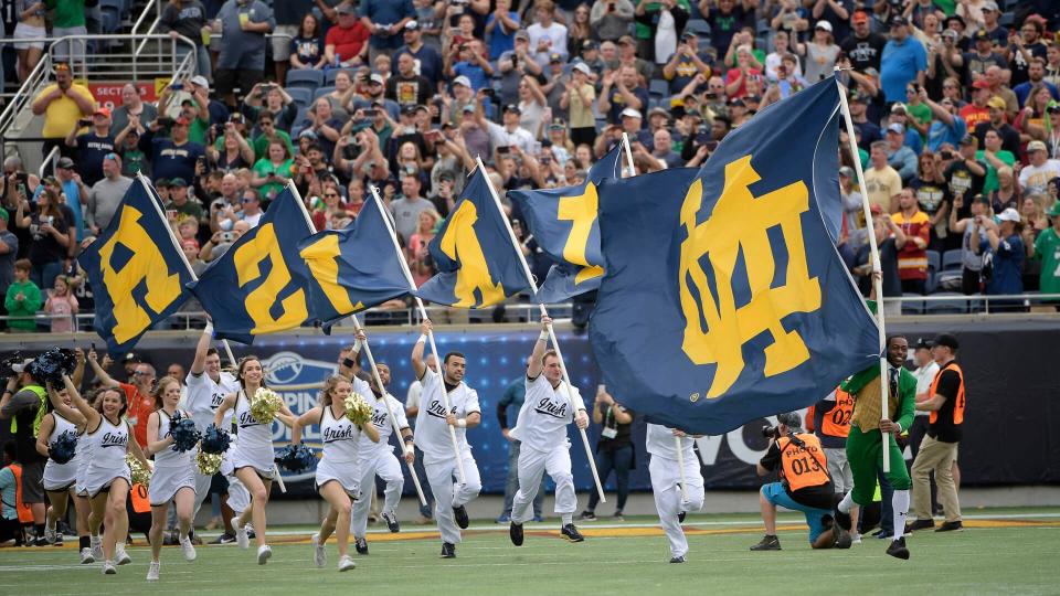 Mandatory Credit: Photo by Phelan M Ebenhack/AP/Shutterstock (10514058az)Notre Dame cheerleaders lead the team onto the field before the Camping World Bowl NCAA college football game against Iowa State, in Orlando, FlaCamping World Bowl Football, Orlando, USA - 28 Dec 2019.