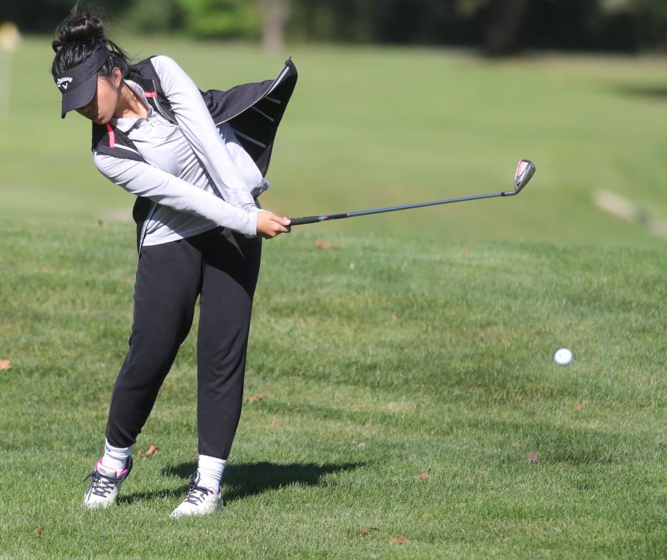 Leah Dang of Green hits a shot on the No. 1 fairway during the Division I district tournament at Brookledge Golf Club.