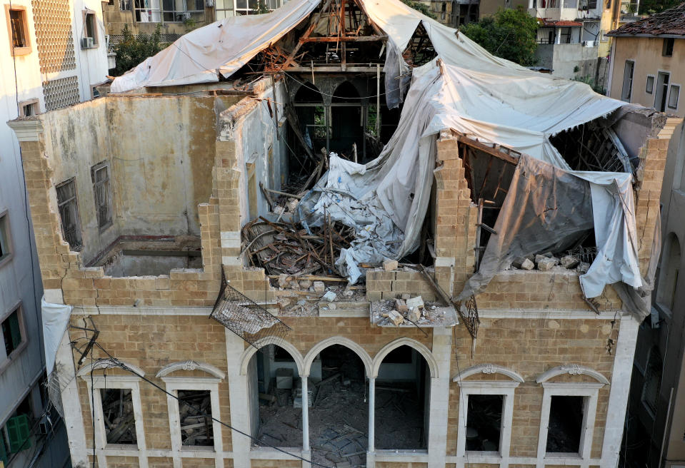 A heritage house that was destroyed by Aug. 4 explosion that hit the seaport of Beirut, Lebanon, Monday Aug. 24, 2020. In the streets of Beirut historic neighborhoods, workers are erecting scaffolding to support buildings that have stood for more than a century - now at risk of collapse after the massive Aug. 4 explosion that tore through the capital. The explosion damaged thousands of buildings, including dozens of Ottoman and French mandate-era structures that had been among the few survivors of a years-old construction frenzy replacing traditional houses with modern buildings. (AP Photo/Hussein Malla)