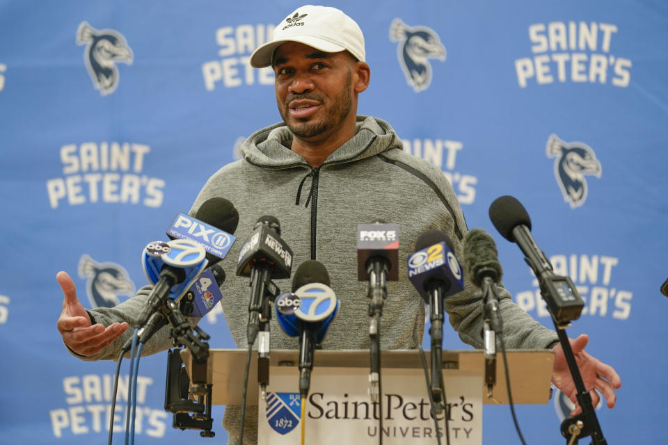 St. Peter's University basketball coach Shaheen Holloway speaks to reporters before NCAA college basketball practice, Tuesday, March 22, 2022, in Jersey City, N.J. (AP Photo/Seth Wenig)