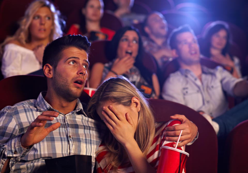 Moviegoers reacting to an onscreen horror