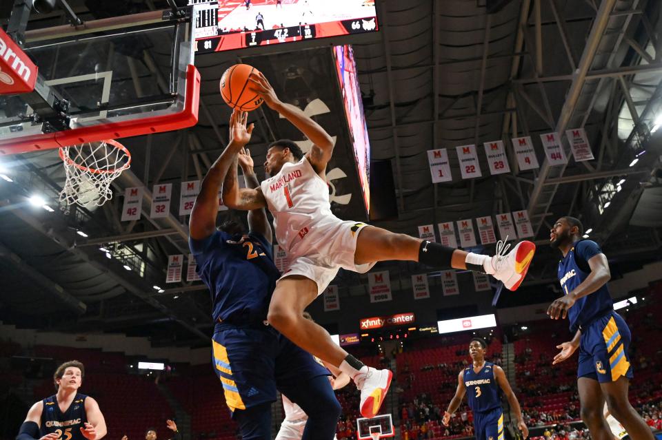 Nov 9, 2021; College Park, Maryland, USA;  Maryland Terrapins guard James Graham III (1) jumps to shoot as Quinnipiac Bobcats forward JJ Riggins (23) defends during the second half at Xfinity Center. Mandatory Credit: Tommy Gilligan-USA TODAY Sports