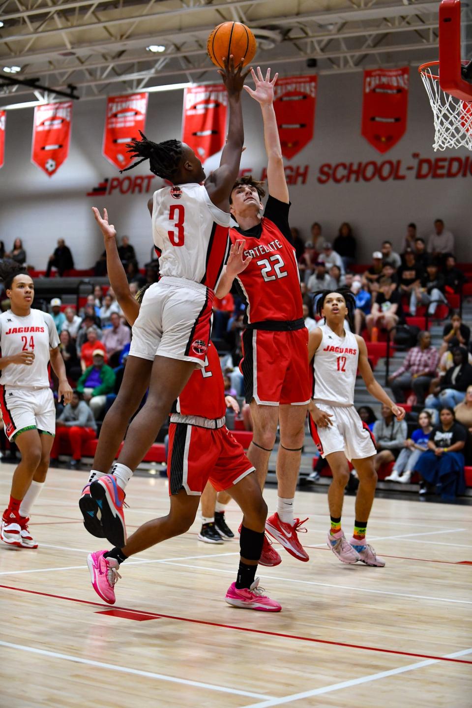 Port St. Lucie’s Makhari Chambliss (3) shoots over Satellite’s Jack Knight (22) in a boys basketball quarterfinal, Thursday, Feb. 8, 2024, in Port St. Lucie.