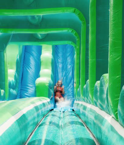 <p>Iggy Azalea/Instagram</p> Iggy Azalea sliding down a water slide