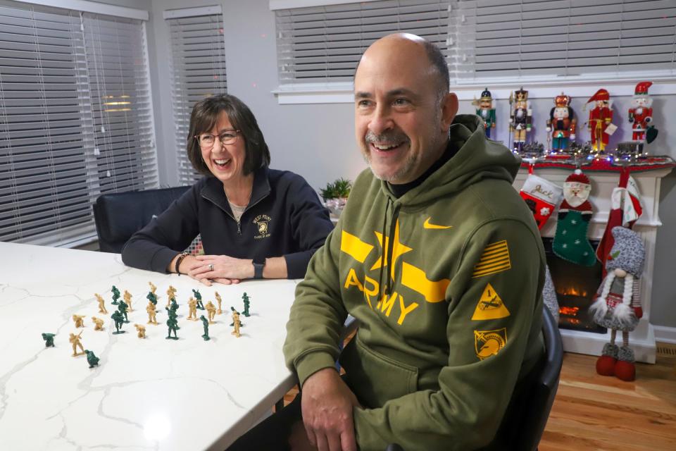 Rosemarie (62) and Tom (58) Merten, of Royal Oak prepare for their trip to attend the Army vs. Navy football game in Boston, buying toy soldiers that they plan to leave at different locations while traveling to the game (an Army tradition), at their home on Monday, Nov. 27, 2023. Their son Peter is a sophomore at the United States Military Academy West Point.