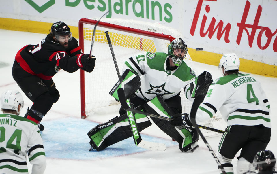 Dallas Stars goaltender Scott Wedgewood (41) makes a glove-save against the Ottawa Senators during third-period NHL hockey game action in Ottawa, Ontario, Monday, Oct. 24, 2022. (Sean Kilpatrick/The Canadian Press via AP)