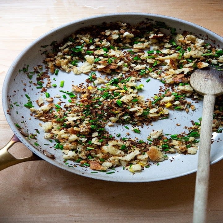 Herb and breadcrumb topping in a skillet.