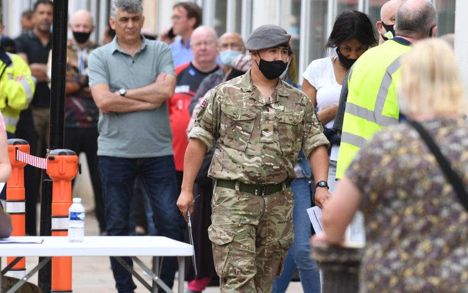 Work goes on in Bolton to tackle Covid as people queue for vaccinations and the military help out - Paul Cousans/Zenpix