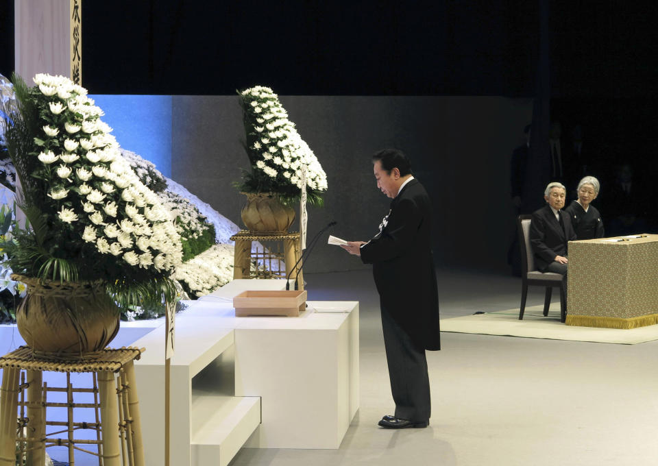 Japanese Prime Minister Yoshihiko Noda, left, gives a memorial address as Emperor Akihito, second right, and Empress Michiko, right, listen to him during the national memorial service for the victims of the March 11, 2011, earthquake and tsunami in Tokyo Sunday, March 11, 2012. Through silence and prayers, people across Japan on Sunday remembered the massive disaster that struck the nation one year ago, killing just over 19,000 people and unleashing the world's worst nuclear crisis in a quarter century. (AP Photo/Japan POOL) JAPAN OUT