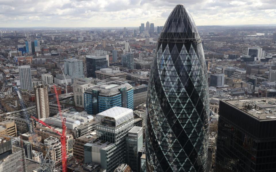 London skyline as seen from Tower 42 with the 'Gherkin' (foreground), 30 St Mary Axe and Canary Wharf (background) prominent.