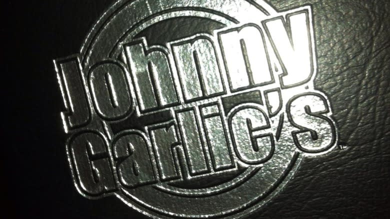 Johnny Garlic's sliver logo on black leather