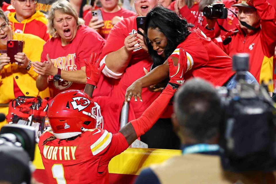 <p>Andrew Mather/Kansas City Chiefs via AP</p> Kansas City Chiefs wide receiver Xavier Worthy (1) and his mother Nicky Jones