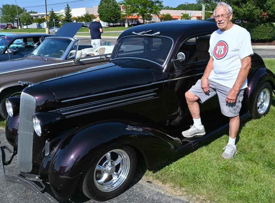 Mike Shaw drives a 1936 Dodge Brothers coupe. That was before Chrysler bought them out. The color is black cherry with the original hood ornament.