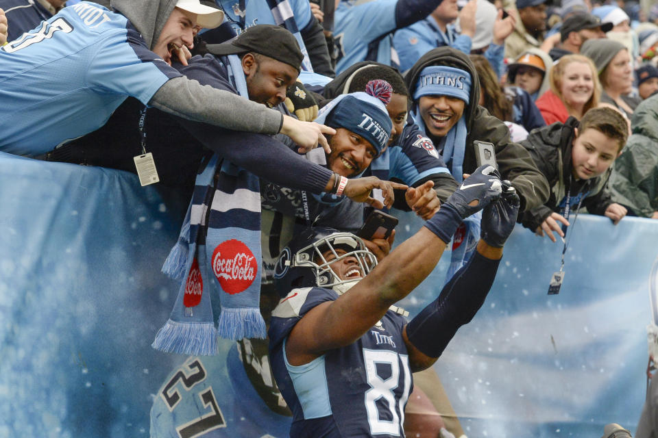 Tennessee Titans tight end Jonnu Smith (81) celebrates with fans after teammate Tajae Sharpe scored a touchdown against the New Orleans Saints in the second half of an NFL football game Sunday, Dec. 22, 2019, in Nashville, Tenn. (AP Photo/Mark Zaleski)