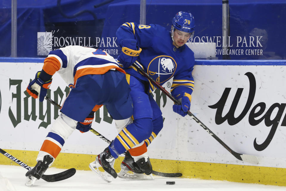 Buffalo Sabres defenseman Jacob Bryson (78) is checked by New York Islanders forward Jordan Eberle (7) during the second period of an NHL hockey game, Monday, May 3, 2021, in Buffalo, N.Y. (AP Photo/Jeffrey T. Barnes)