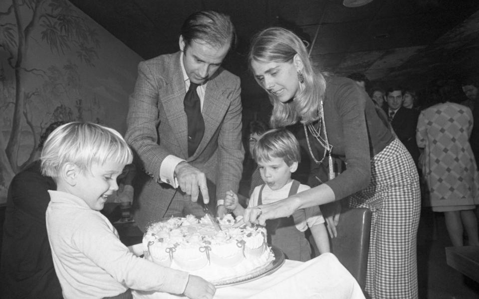 Joe and Neilia Biden cut his 30th birthday cake at a party, with Hunter and Beau - Bettmann