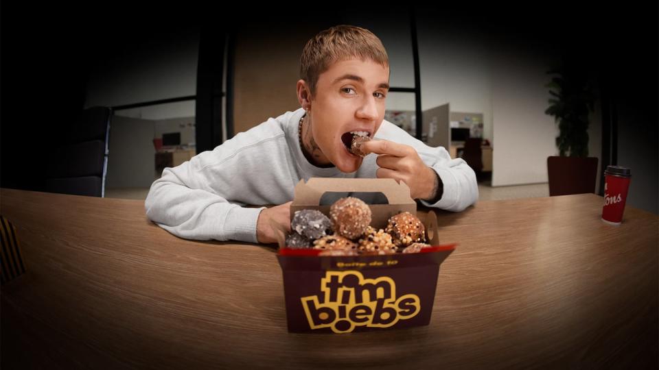 Justin Bieber samples a box of TimBiebs.