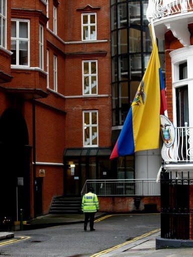 A British police officer patrols in June 2012 outside the Ecuadorian embassy in London. Even if Ecuador decides to grant Wikileaks founder Julia Assange political asylum, it remains to be seen if British authorities would allow him to leave the country. In the absence of a safe conduct agreement between Quito and London, he could stay on embassy grounds indefinitely