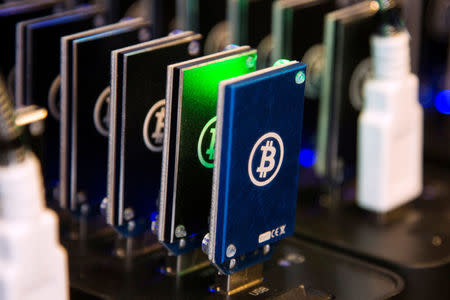 FILE PHOTO - A chain of block erupters used for Bitcoin mining is pictured at the Plug and Play Tech Center in Sunnyvale, California October 28, 2013. REUTERS/Stephen Lam/File Photo