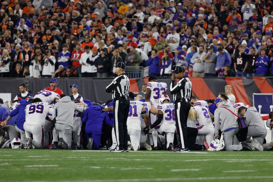 CINCINNATI, OHIO - JANUARY 02: Buffalo Bills players huddle after teammate Damar Hamlin #3 collapsed following a tackle against the Cincinnati Bengals during the first quarter at Paycor Stadium on January 02, 2023 in Cincinnati, Ohio. (Photo by Kirk Irwin/Getty Images)