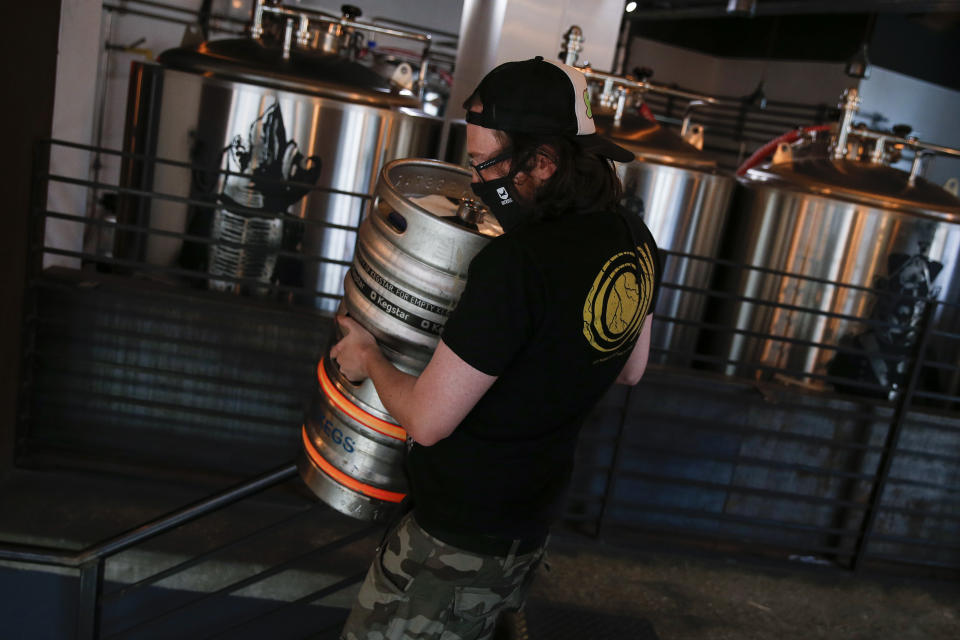 LONDON, ENGLAND - JULY 03: Staff at BrewDog Tower Hill prepare to reopen tomorrow with social distancing measures in place on Friday July 3, 2020 in London, England. After being shuttered for months due to the Covid-19 pandemic, pubs and restaurants, many of which have already been serving for take-away, can fully reopen as of July 4. (Photo by Hollie Adams/Getty Images)