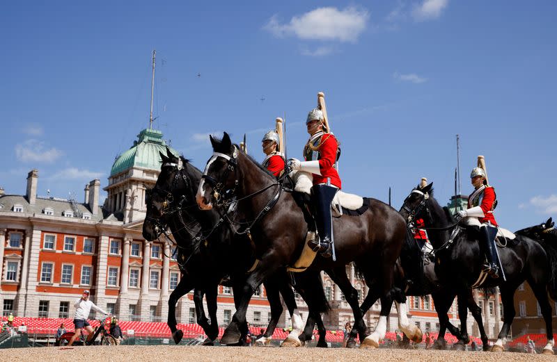 FILE PHOTO: Soldiers from the Household Cavalry cross the Horse Guards Parade in London