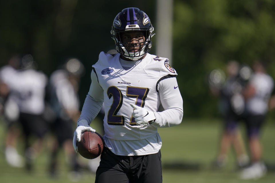 Baltimore Ravens running back J.K. Dobbins works out during the team's NFL football training, Tuesday, June 15, 2021, in Owings Mills, Md. (AP Photo/Julio Cortez)