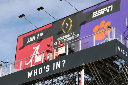 Clemson Tigers fan Nancy Volland and Alabama Crimson Tide supporter Llyas Ross Sr., who have been living on ESPN Billboard ahead of Monday's national championship game as part of an ESPN contest since December 26, 2018, are seen in this photo taken downtown San Jose, California, U.S., on January 3, 2019. Picture taken January 3, 2019. Courtesy ESPN/Handout via REUTERS