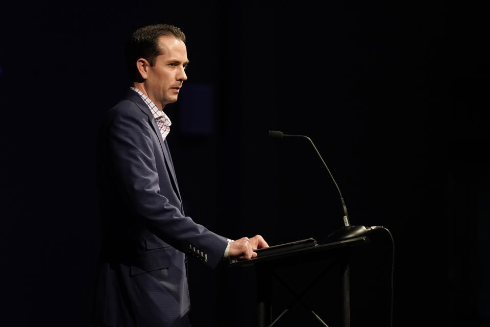 Patrick Ireland, who was wounded in the massacre at Columbine High School nearly 20 years earlier, speaks during a faith-based memorial service for the victims of the massacre, at a community church, Thursday, April 18, 2019, in Littleton, Colo. (Rick Wilking/Pool Photo via AP)