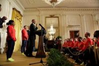 U.S. President Barack Obama speaks next to 2016 Olympic individual all-around gymnast Simone Arianne Biles (L) as he welcomes U.S. Olympic and Paralympics teams at the White House in Washington, U.S., September 29, 2016. REUTERS/Yuri Gripas