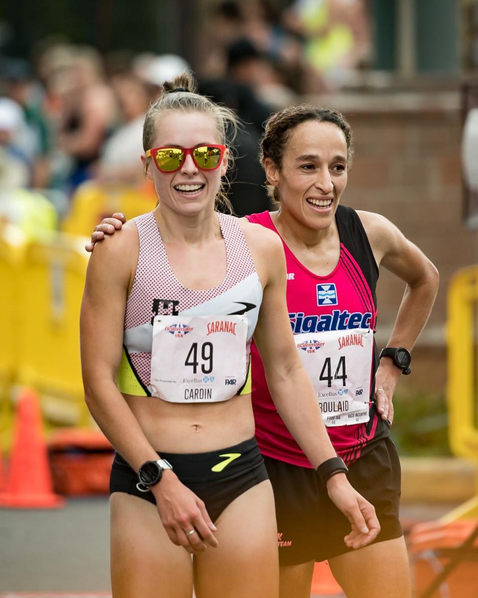 Jessie Cardin of Rochester Hills, MI and Kaoutar Boulaid cross the finish line of the Boilermaker 15K Road Race in Utica, NY on Sunday, July 9, 2023.