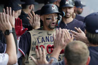 Minnesota Twins' Royce Lewis celebrates in the dugout after hitting a grand-slam home run in the second inning of a baseball game against the Cleveland Guardians, Monday, Sept. 4, 2023, in Cleveland. (AP Photo/Sue Ogrocki)