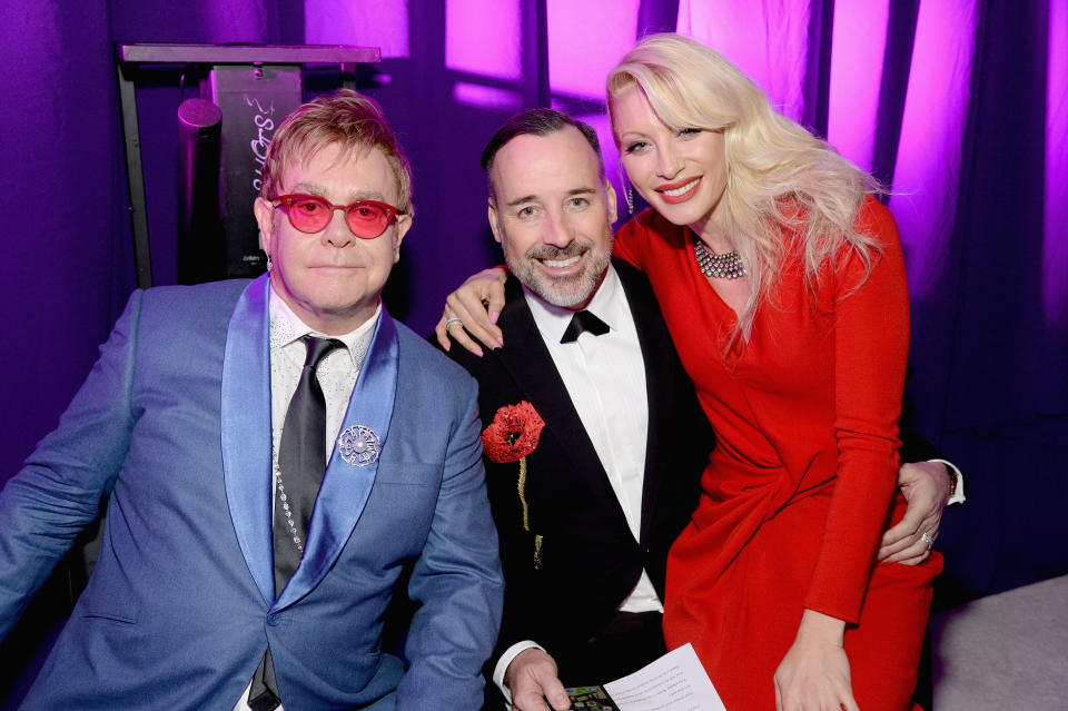 LOS ANGELES, CA - FEBRUARY 22: Singer songwriters Sir Elton John (L), Dani Behr (R) and David Furnish (C) attend the 23rd Annual Elton John AIDS Foundation Academy Awards Viewing Party on February 22, 2015 in Los Angeles, California.  (Photo by Michael Kovac/Getty Images for EJAF)