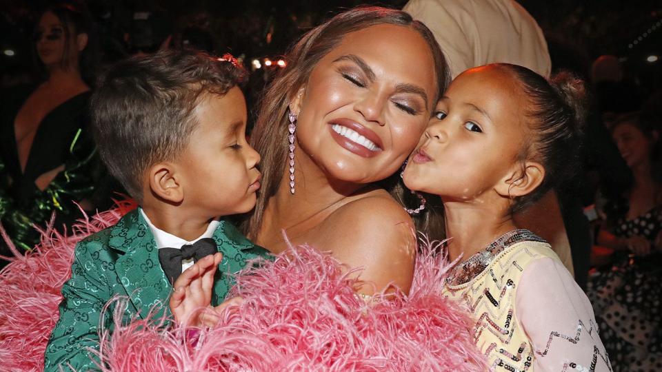 LAS VEGAS, NEVADA - APRIL 03: (L-R) Miles Stephens, Chrissy Teigen, and Luna Stephens attend the 64th Annual GRAMMY Awards at MGM Grand Garden Arena on April 03, 2022 in Las Vegas, Nevada. (Photo by Johnny Nunez/Getty Images for The Recording Academy)