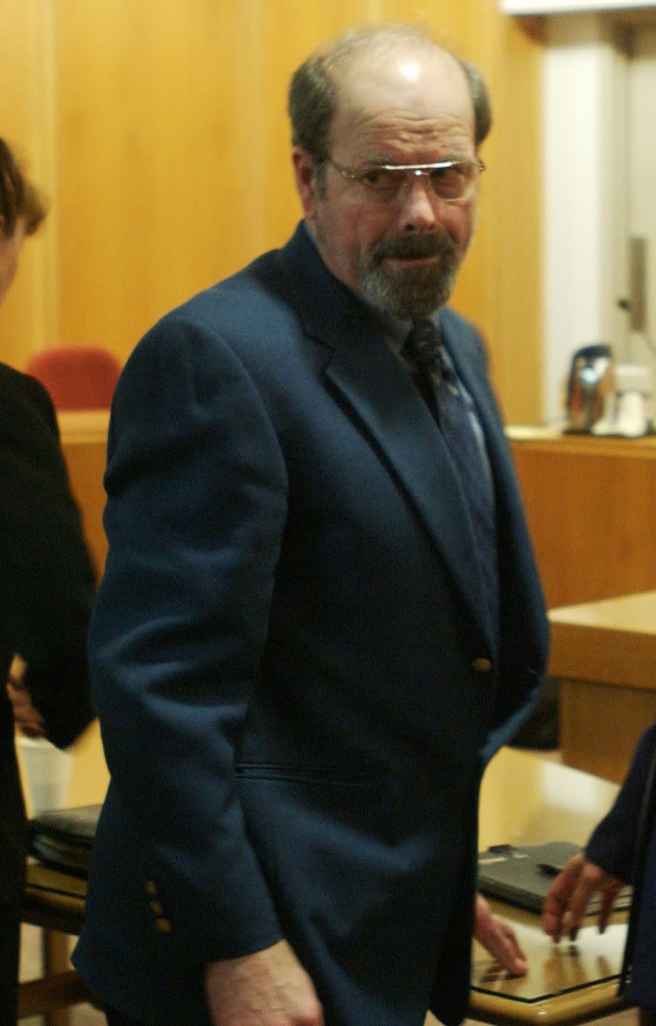 btk killer dennis rader turning back and looking to his right as he leaves a courtroom