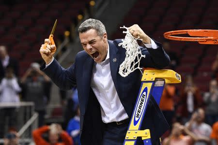Mar 30, 2019; Louisville, KY, United States; Virginia Cavaliers head coach Tony Bennett reacts during the net cutting ceremony after the championship game against the Purdue Boilermakers of the south regional of the 2019 NCAA Tournament at KFC Yum Center. Mandatory Credit: Jamie Rhodes-USA TODAY Sports
